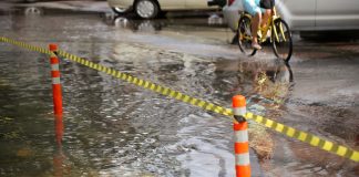 Young Man Pedals Through Flood To Give Elderly Pedicab Driver A Rest